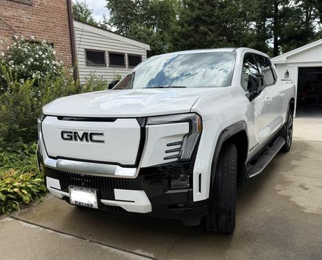White 2025 GMC Sierra EV Max Range Denali