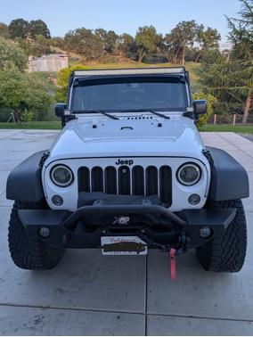 White 2014 Jeep Wrangler Unlimited Sport