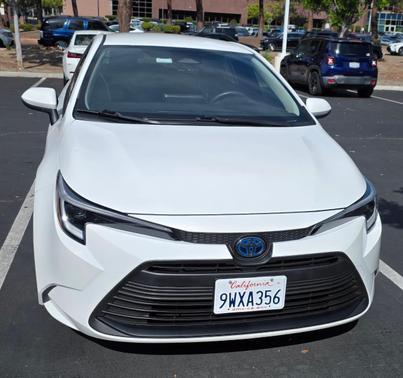 White 2025 Toyota Corolla Hybrid LE
