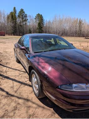 Red 1995 Oldsmobile Aurora Base