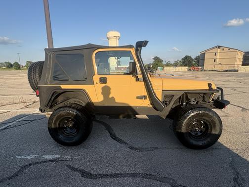 Yellow 2002 Jeep Wrangler Sahara