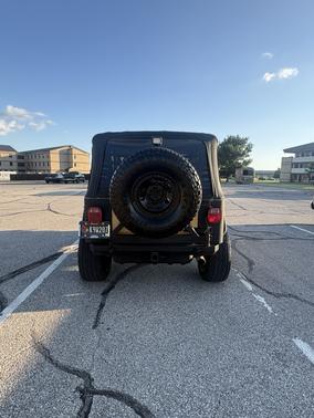 Yellow 2002 Jeep Wrangler Sahara