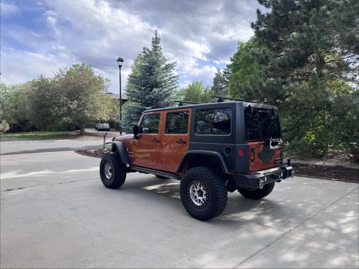 Orange 2011 Jeep Wrangler Unlimited Sport