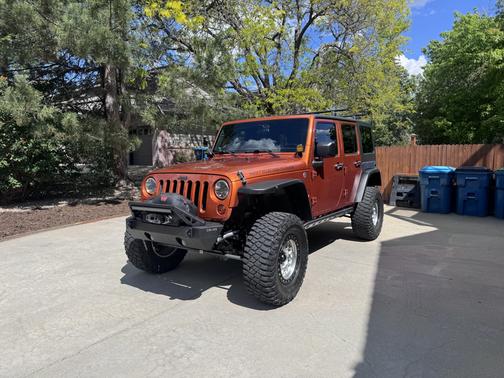 Orange 2011 Jeep Wrangler Unlimited Sport