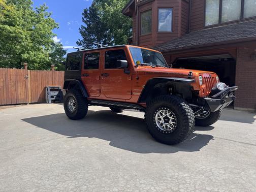 Orange 2011 Jeep Wrangler Unlimited Sport