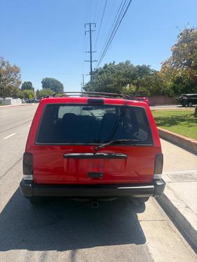 Red 1997 Jeep Cherokee Sport