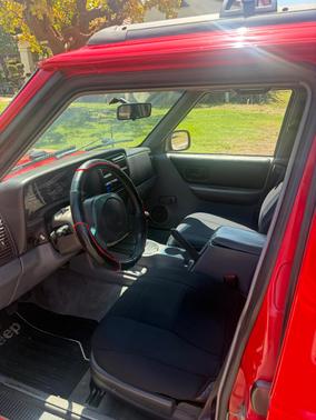 Red 1997 Jeep Cherokee Sport