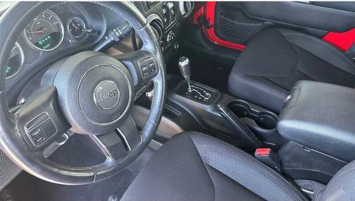 Red 2015 Jeep Wrangler Unlimited Sport
