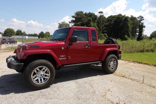 Red 2012 Jeep Wrangler Unlimited Sahara