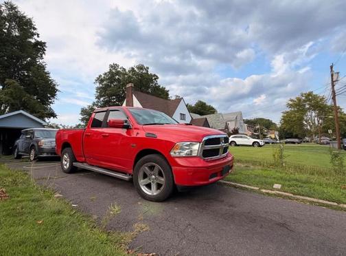 Red 2015 RAM 1500 SLT