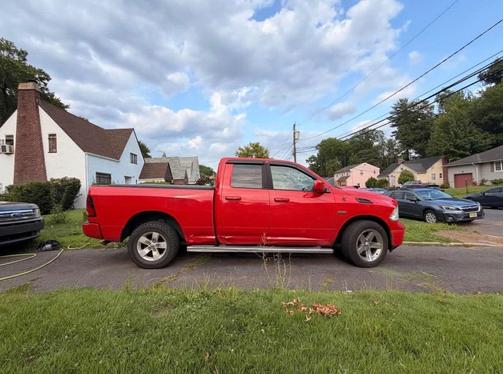 Red 2015 RAM 1500 SLT
