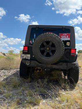 Black 2015 Jeep Wrangler Unlimited Sport
