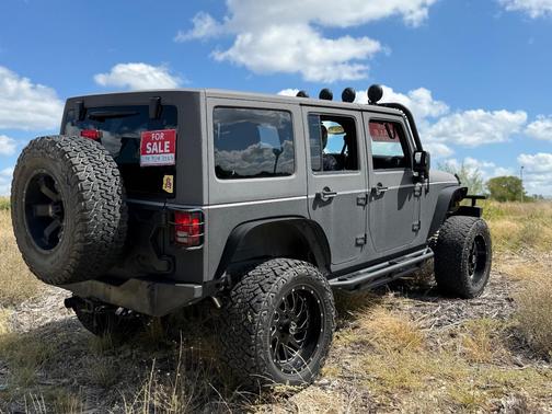 Black 2015 Jeep Wrangler Unlimited Sport