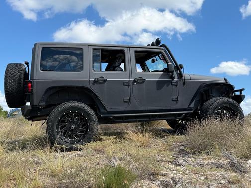 Black 2015 Jeep Wrangler Unlimited Sport