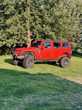 Red 2007 Jeep Wrangler Unlimited Sahara