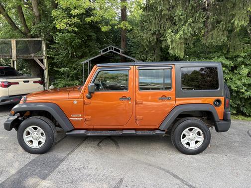 Orange 2011 Jeep Wrangler Unlimited Sport