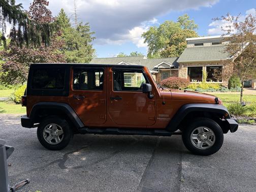 Orange 2011 Jeep Wrangler Unlimited Sport