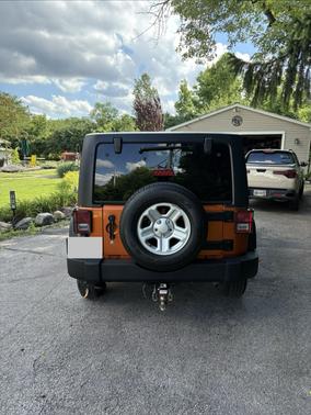 Orange 2011 Jeep Wrangler Unlimited Sport