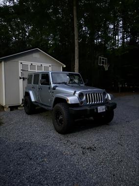 Blue 2012 Jeep Wrangler Unlimited Sport RHD