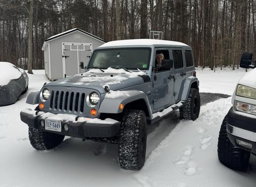 Blue 2012 Jeep Wrangler Unlimited Sport RHD
