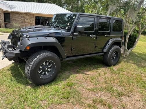 Black 2014 Jeep Wrangler Unlimited Sport