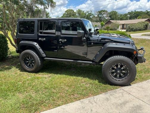 Black 2014 Jeep Wrangler Unlimited Sport