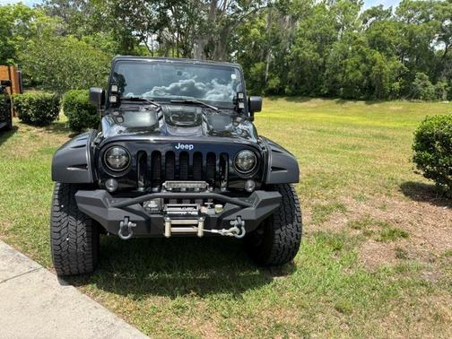 Black 2014 Jeep Wrangler Unlimited Sport