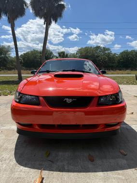 Orange 2004 Ford Mustang GT