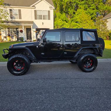 Black 2015 Jeep Wrangler Unlimited Sport