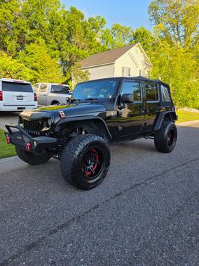 Black 2015 Jeep Wrangler Unlimited Sport