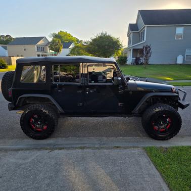 Black 2015 Jeep Wrangler Unlimited Sport