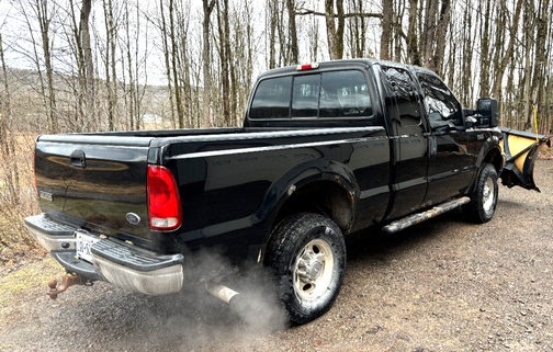 Black 2003 Ford F-250 XLT SuperCab Super Duty