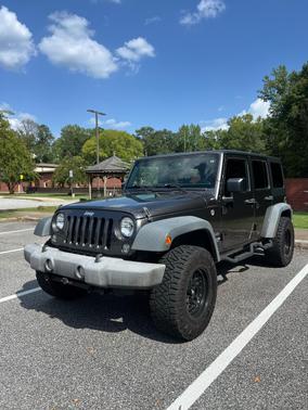 Gray 2016 Jeep Wrangler Unlimited Sport