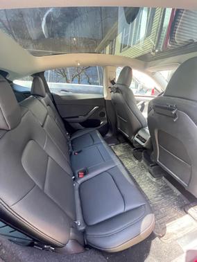 Red 2025 Tesla Model Y Long Range RWD