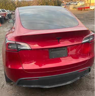 Red 2025 Tesla Model Y Long Range RWD