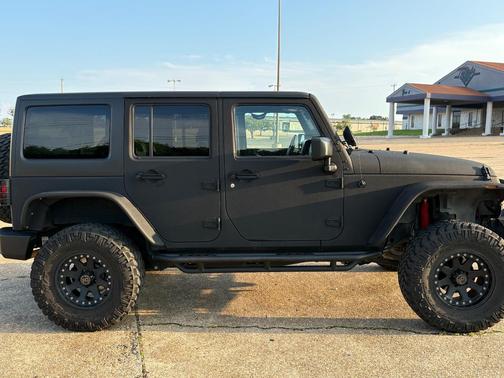Black 2014 Jeep Wrangler Unlimited Sport