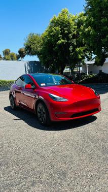 Red 2024 Tesla Model Y Long Range