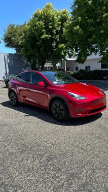 Red 2024 Tesla Model Y Long Range
