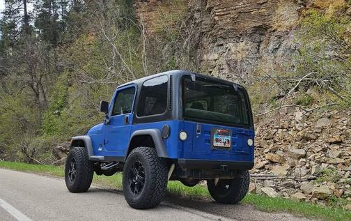 Blue 1999 Jeep Wrangler SE