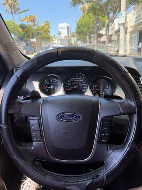 Red 2010 Ford Taurus SEL