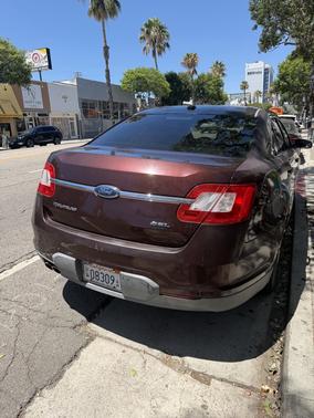 Red 2010 Ford Taurus SEL