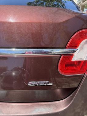 Red 2010 Ford Taurus SEL