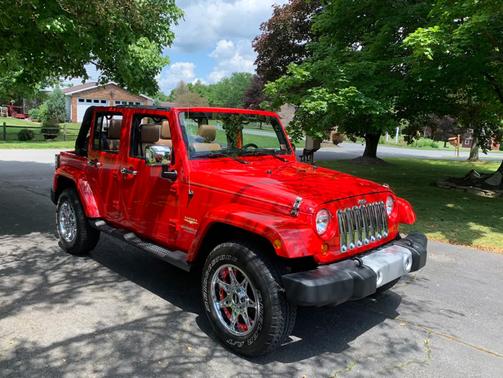 Red 2012 Jeep Wrangler Unlimited Sahara