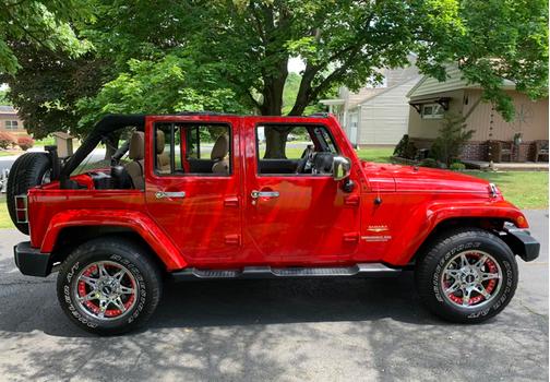 Red 2012 Jeep Wrangler Unlimited Sahara