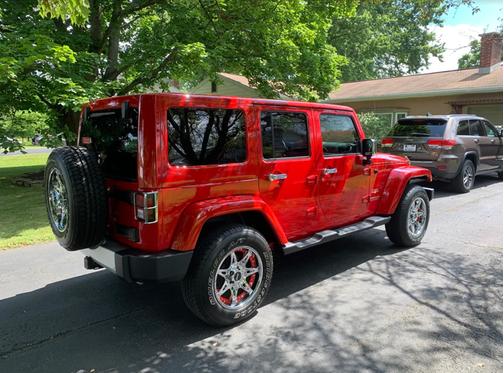 Red 2012 Jeep Wrangler Unlimited Sahara