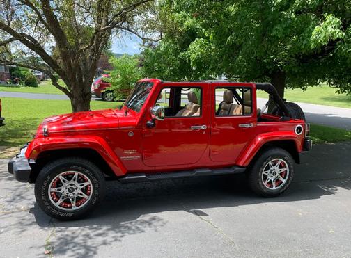 Red 2012 Jeep Wrangler Unlimited Sahara