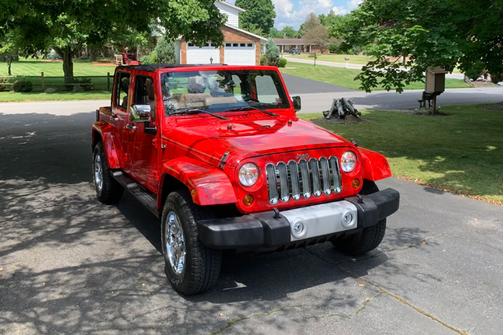 Red 2012 Jeep Wrangler Unlimited Sahara