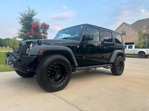 Black 2014 Jeep Wrangler Unlimited Sport
