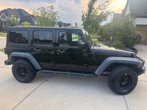 Black 2014 Jeep Wrangler Unlimited Sport