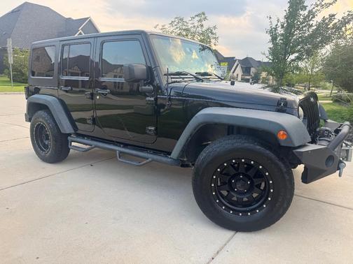 Black 2014 Jeep Wrangler Unlimited Sport